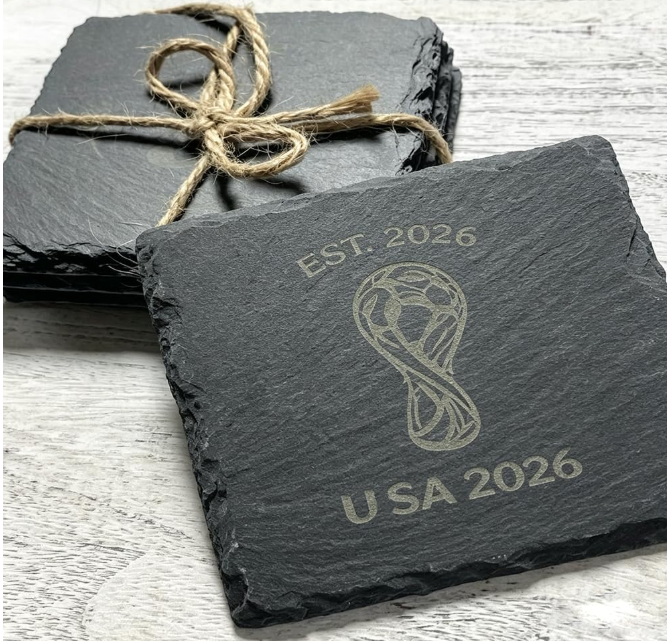 Slate coaster set tied with twine, engraved with a World Cup soccer trophy design and EST. 2026 USA 2026 text